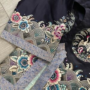 Vintage hand made jacket with amazing details. Needs to be re-sewn on neckline.